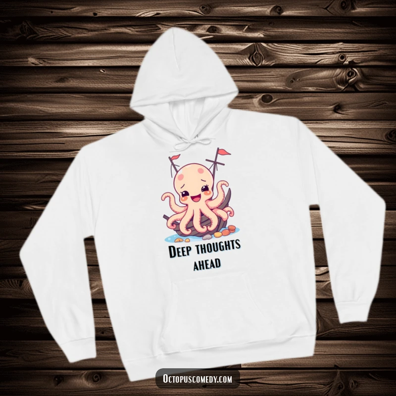 Funny hoodie showing a delighted octopus peeking from behind a mysterious shipwreck, embodying a humorous adventure.