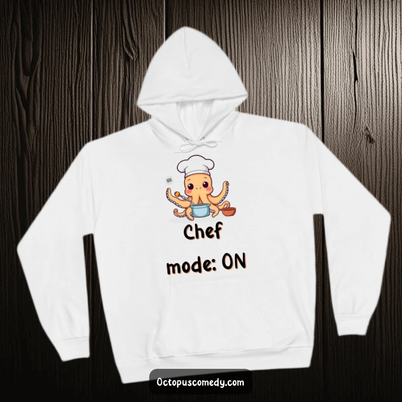 Funny hoodie depicting an octopus wearing a chef hat, using all its arms to cook up a storm, perfect for cozy foodies.