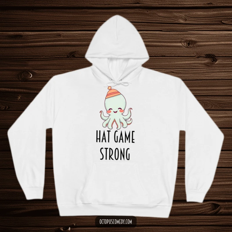 Funny octopus wearing a tiny hat and giggling, a cozy and humorous hoodie for cheerful days.