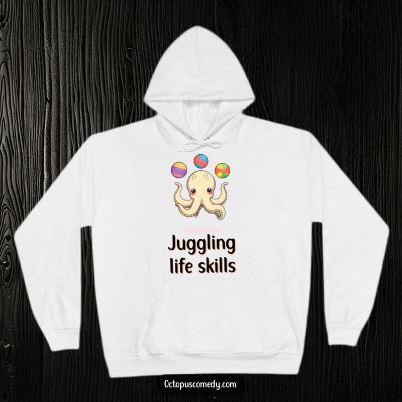 Funny octopus playfully juggling three colorful balls with its tentacles, a cozy and humorous hoodie.
