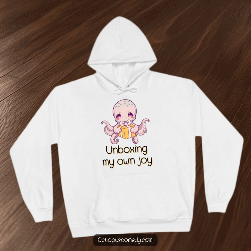Funny Octopus Hoodie: A warm hoodie showcasing a funny octopus in the act of playfully unwrapping a colorful, small gift box.